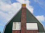 Gelijkenis met de zijgevel van J.C. Rijpstraat 8-10, eveneens van Rozema.
<br/>
Gert-Jan Lobbes, 2019